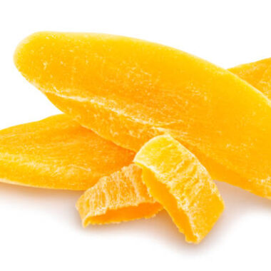 Sliced dried mango path isolated