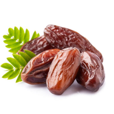 Dry dates fruits with leaves on white backgrounds closeup